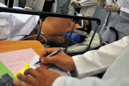 A doctor takes notes about a simulated casualty condition May 21, 2016, at King Hussien Medical Center during a massive casualty exercise as part of Eager Lion ’16. Eager Lion 2016, which a military bi-lateral exercise with the Hashemite Kingdom of Jordan designed to strengthen relationships and interoperability between partner nations.