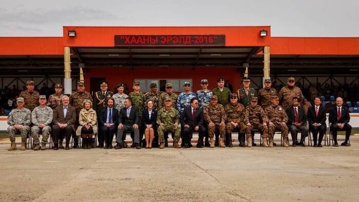 Distinguished visitors and multinational participants pose for a photo after the opening ceremony for Khaan Quest 2016, at the Five Hills Training Area, Mongolia, May 22, 2016. Khaan Quest is an annual, multinational peacekeeping operations exercise conducted in Mongolia and is the capstone exercise for this year's United Nations Global Peace Operations Initiative program. 