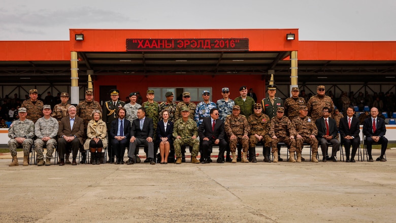 Distinguished visitors and multinational participants pose for a photo after the opening ceremony for Khaan Quest 2016, at the Five Hills Training Area, Mongolia, May 22, 2016. Khaan Quest is an annual, multinational peacekeeping operations exercise conducted in Mongolia and is the capstone exercise for this year's United Nations Global Peace Operations Initiative program. 