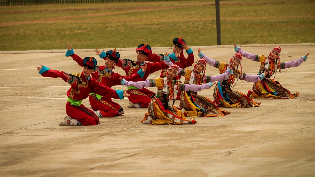 The Mongolian Military Dance and Song Ensemble perform a traditional Mongolian dance for service members of participating nations for the Khaan Quest 2016 opening ceremony at Five Hills Training Area, Mongolia, May 22, 2016. Khaan Quest is an annual, multinational peacekeeping operations exercise conducted in Mongolia and is the capstone exercise for this year's United Nations Global Peace Operations Initiative program. 