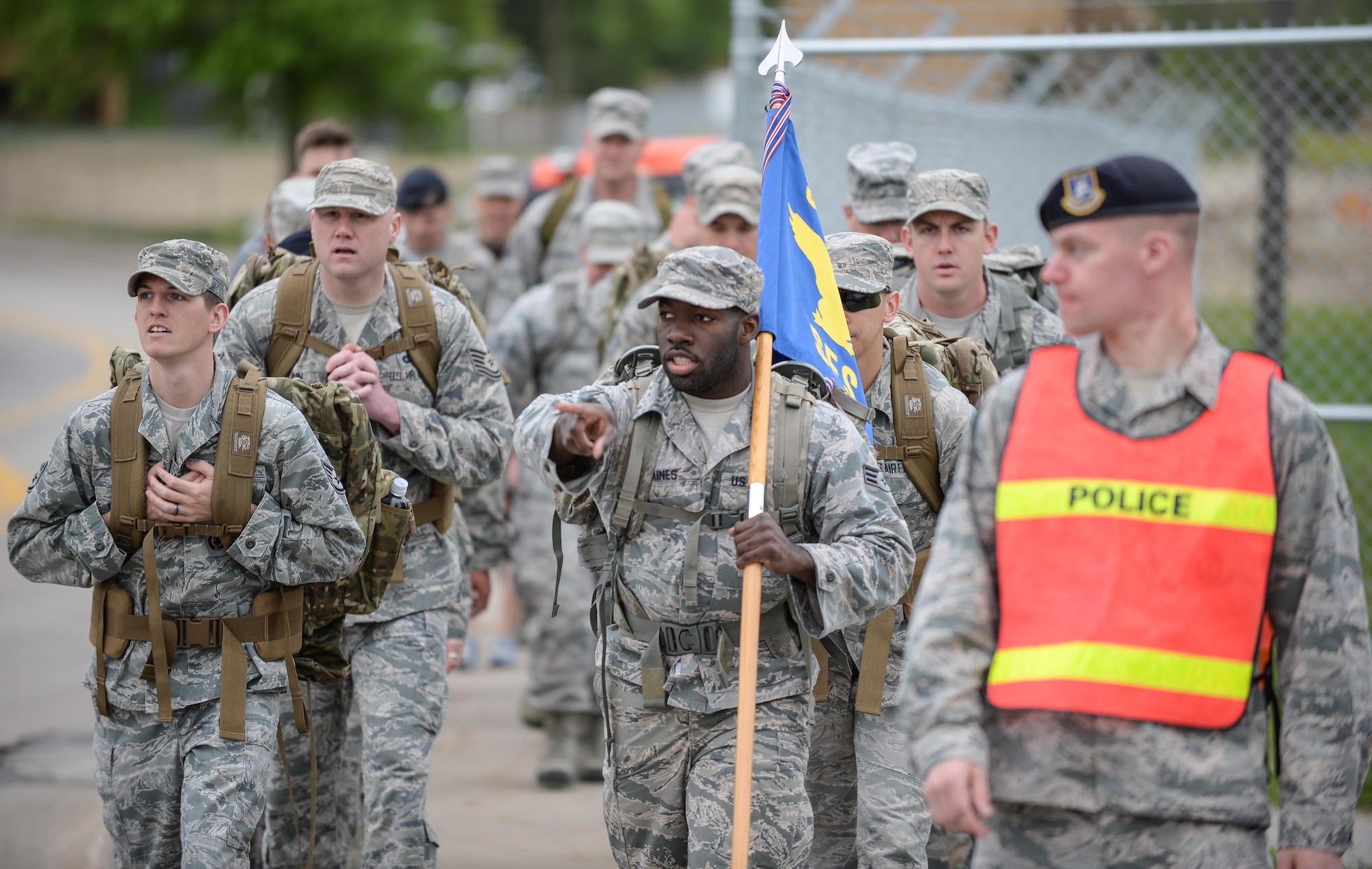 Airmen assigned to the 55th Security Forces Squadron prepare for a ruck march at Offutt Air Force Base, Neb., May 16, 2016 as part of the opening ceremony for National Police Week. Police Week in an annual celebration and time to honor law enforcement officials and agencies throughout the nation. (U.S. Air Force photo by Zachary Hada)
