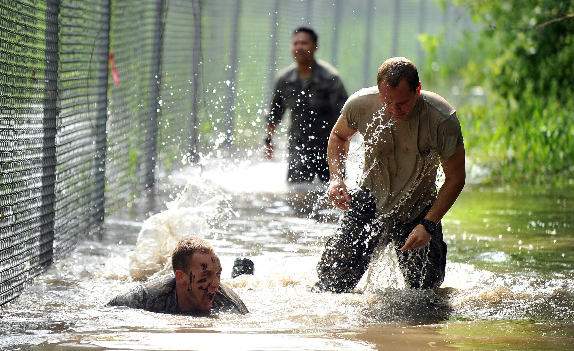 Members of Team Offutt compete in the Warrior Challenge along the perimeter of Offutt Air Force Base, Nebraska, May 19, 2016. The challenge was part of Police Week activities. (U.S. Air Force photo by Josh Plueger)
