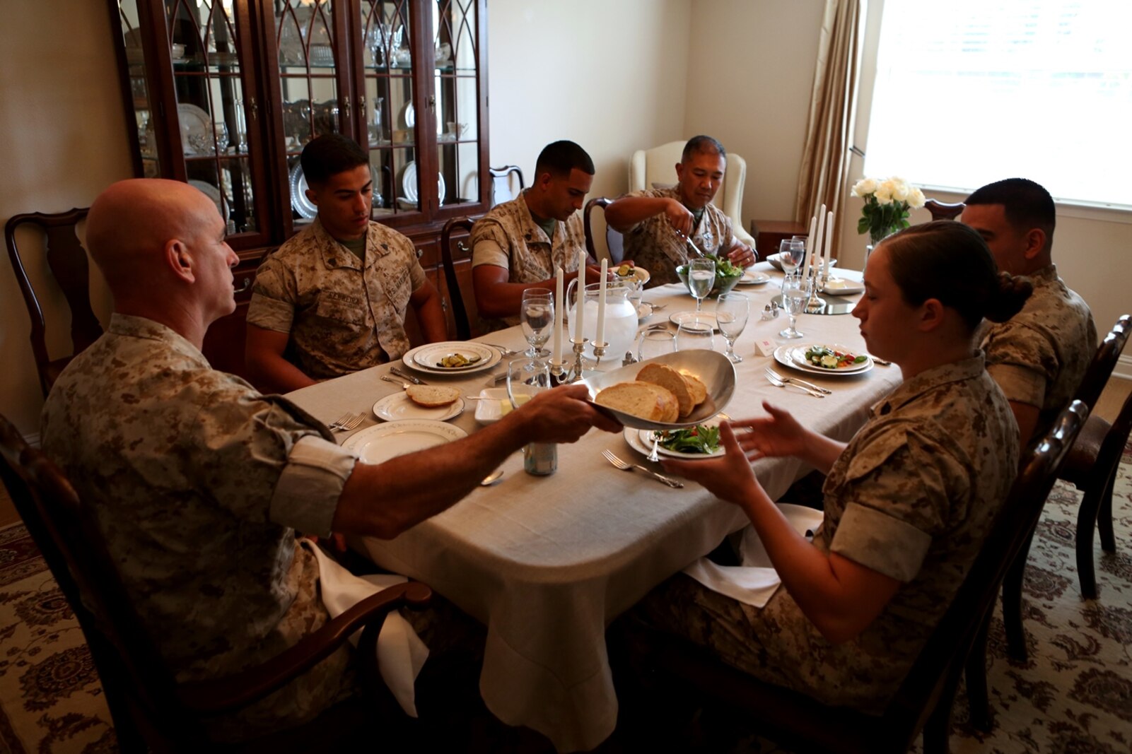 Meritoriously promoted sergeants from 1st Marine Logistics Group discuss leadership and the new role they will have as sergeants of Marines during a lunch hosted for them by the commanding general aboard Camp Pendleton, Calif., May 17, 2016. During the gathering the Marines had an opportunity to speak with their most senior leaders, to include the MLG commanding general, sergeant major, and command master chief. The four Marines promoted were Sgt. Olivia Berry, a combat engineer with Combat Logistics Battalion 5, Sgt. Lucas Ferreira, a combat engineer with 7th Engineer Support Battalion, Sgt. Jose Gaytan, an engineer equipment mechanic from Combat Logistics Battalion 11, and Sgt. Hector RiveraGuzman, a warehouse clerk with 1st Supply Battalion. (U.S. Marine Corps photo by Sgt. Carson Gramley/released)