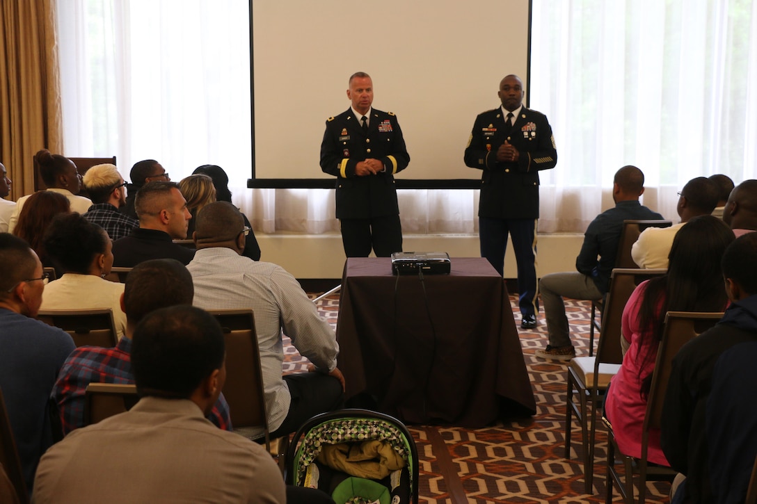 Army Reserve Brig. Gen. Vincent B. Barker, commanding general of the 310th Sustainment Command (Expeditionary) (left), and Command Sgt. Maj. Levi G. Maynard, senior enlisted advisor of the 310th Sustainment Command (Expeditionary) (right), speak to the Soldiers and Family members of the 313th Movement Control Battalion, headquartered in Baltimore, Md., during the yellow ribbon reintegration program event at the Tyson’s Corner, Va. Sheraton Hotel, May 6-8, 2016. The event came prior to deployment of the Army Reserve Soldiers of the 313th Movement Control Battalion, and was designed to prepare airmen and their spouses for stresses and possible needs that can arise during a deployment.