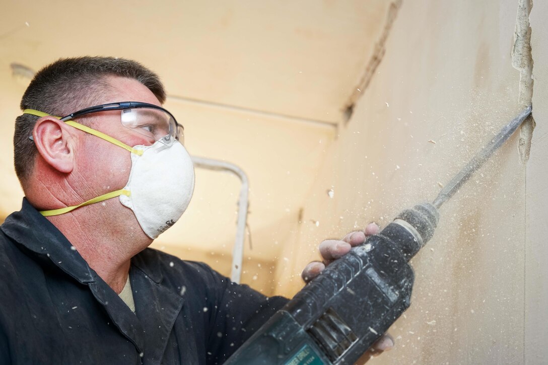 Air Force Tech. Sgt. Brian Harrison cuts a groove in a wall for wiring at a care facility for the elderly during a U.S. European Command humanitarian project in Yerevan, Armenia, May 13, 2016. Harrison is an electrician assigned to the Georgia Air National Guard’s 116th Civil Engineer Squadron. Air National Guard photo by Senior Master Sgt. Roger Parsons