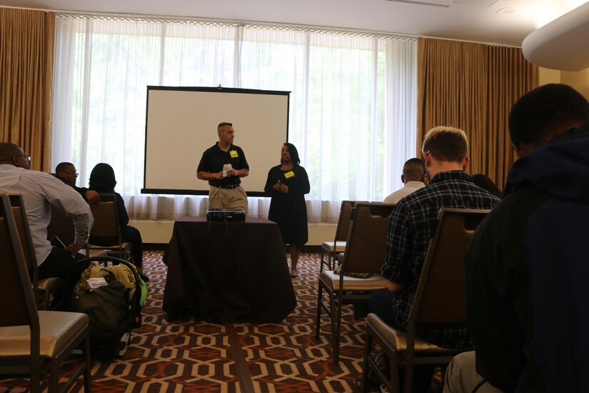 Army Reserve Lt. Col. Christopher J. Buzard, commander of the 313th Movement Control Battalion (left), and Command Sgt. Maj. Selena C. Pope, senior enlisted advisor of the 313th Movement Control Battalion (right), speak to the Soldiers and Family members of the 313th MCB during the yellow ribbon reintegration program event at the Tyson’s Corner, Va. Sheraton Hotel, May 6-8, 2016. The event came prior to deployment of the Army Reserve Soldiers of the 313th Movement Control Battalion, headquartered in Baltimore, Md., and was designed to prepare airmen and their spouses for stresses and possible needs that can arise during a deployment.