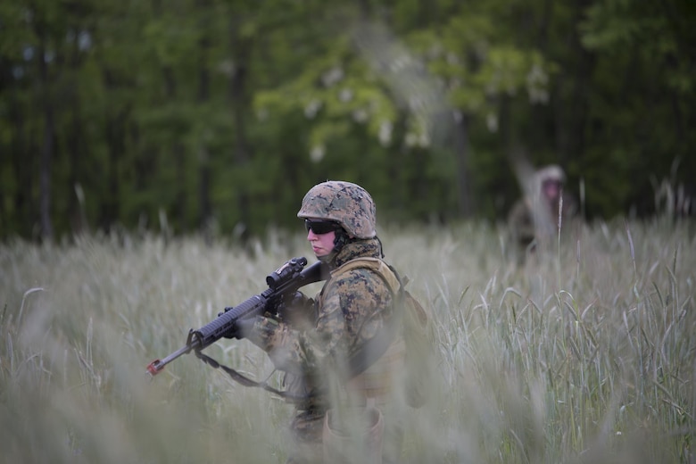 Lance. Cpl. Rebecca Brewer, military police, with 4th Law Enforcement Battalion, Force Headquarters Group, Marine Forces Reserve, patrols through high grass during exercise Platinum Wolf 2016 at Peacekeeping Operations Training Center South Base, Bujanovac, Serbia, May 16, 2016. The Marines joined partner nations from Bosnia, Bulgaria, Macedonia, Montenegro, Slovenia and Serbia to train in patrolling, cordon and search operations, peacekeeping operations, and non-lethal weapons.