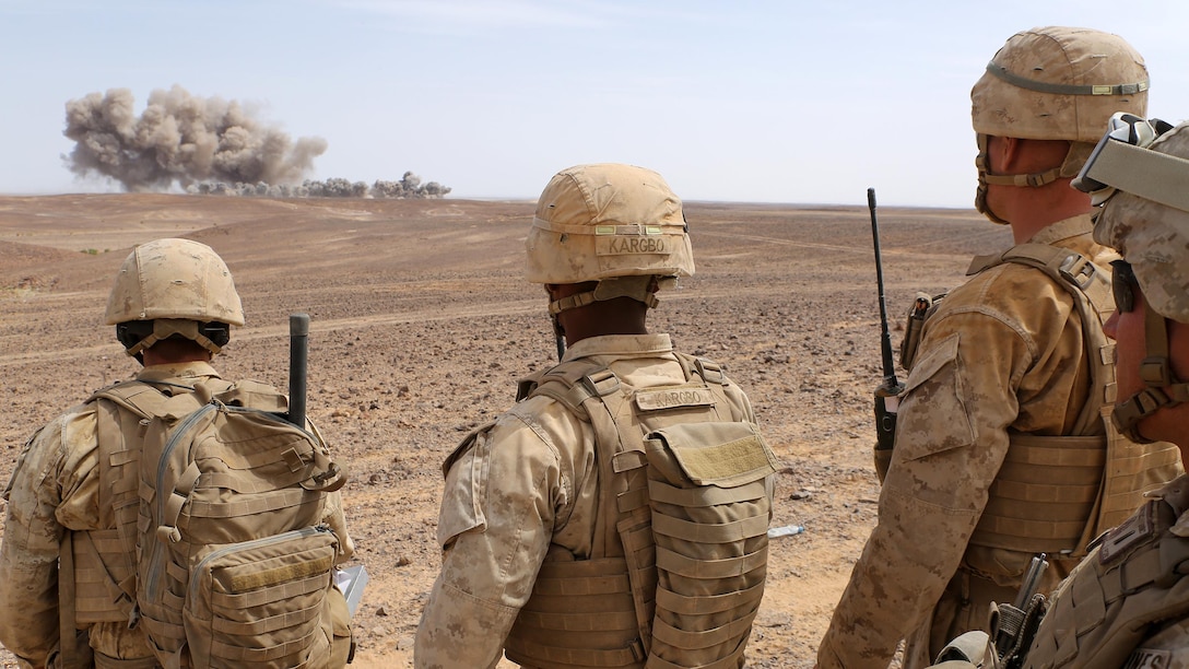 Marines with the Fire Support Team for Kilo Company, Battalion Landing Team 3rd Battalion, 6th Marine Regiment, 24th Marine Expeditionary Unit, observe ordnance from U.S. Air Force B-52 Stratofortress bombers during a combined arms live-fire event as part of exercise Eager Lion 2015 in Jordan, May 18, 2015. Eager Lion is a recurring multi-national exercise designed to strengthen military-to-military relationships, increase interoperability between partner nations and enhance regional security and stability. The 24th MEU is embarked on the ships of the Iwo Jima Amphibious Ready Group and is deployed to maintain regional security in the U.S. 5th Fleet area of operations. 