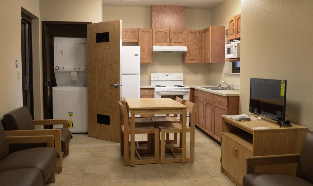 Members of the 27th Special Operations Wing were provided a walk-through of the newest dormitory facility following a ceremony May 18, 2016, at Cannon Air Force Base, N.M. The building provides state-of-the-art energy upgrades that utilize photovoltaic panels which provide power to the facility and help reduce the carbon footprint of the installation. (U.S. Air Force photo/Staff Sgt. Alexx Pons)