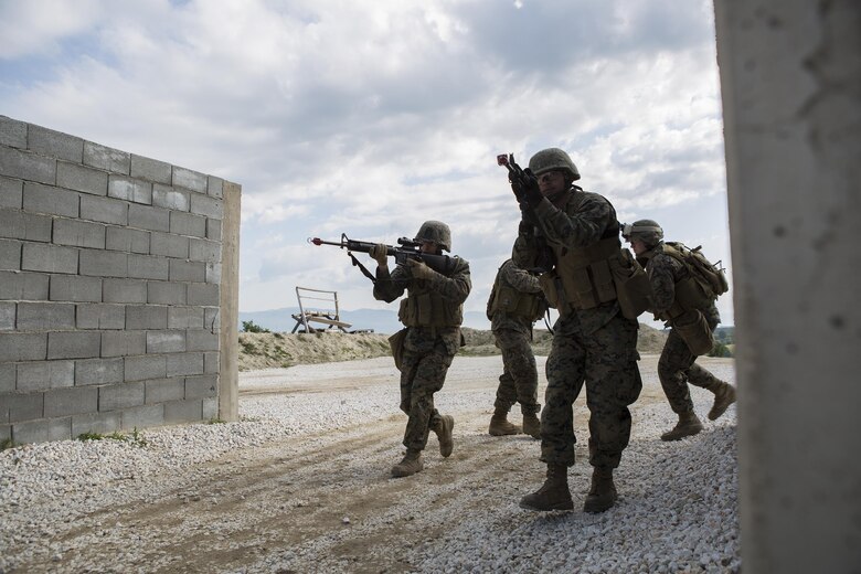 Reserve Marines with 4th Law Enforcement Battalion, Force Headquarters Group, Marine Forces Reserve, practice clearing a house during exercise Platinum Wolf 2016 at Peacekeeping Operations Training Center South Base, Bujanovac, Serbia, May 118, 2016. The Marines are working with the partner nations of Bosnia, Bulgaria, Macedonia, Montenegro, Slovenia and Serbia to share new ideas, build interoperability, and master peacekeeping operations.