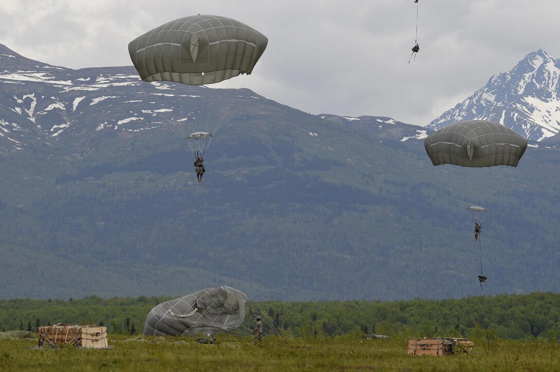 Paratroopers prepare to conduct parachute landing falls at Malemute drop zone during joint airborne and air transportability training at Joint Base Elmendorf-Richardson, Alaska, May 19, 2016. Air Force photo by Alejandro Pena