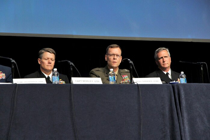 Marine Corps Systems Command Commander Brig. Gen. Joseph Shrader (center) joined Navy and Coast Guard acquisition leaders to discuss the future of equipping and sustaining the sea services at the Navy League’s Sea Air Space Global Maritime Exposition at National Harbor, Maryland, May 18. He outlined the top four acquisition challenges and opportunities the Corps is addressing to ensure readiness today and tomorrow. (U.S. Marine Corps photo by Ashley Calingo)