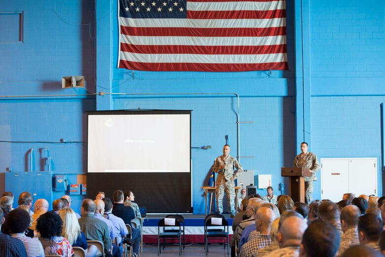 Chief Master Sgt. Joshua Drake, 45th Mission Support Group Superintendent, recognizes the hard work and dedication of his unit during their group’s Commander’s Call April 20, 2016 at Cape Canaveral Air Force Station. The group's objective was to gather together in a location where the 45th Space Wing's launch operations happen to get an up close and personal with the mission and history of the wing in an interactive, informative way. The 45th MSG's five squadrons provide total customer support for the world's busiest spaceport, assuring success of launch, range and expeditionary operations. Also, the 45th MSG Det.1 is responsible for the day-to-day operations CCAFS. (U.S. Air Force photo by Matthew Jurgens/Released) 
