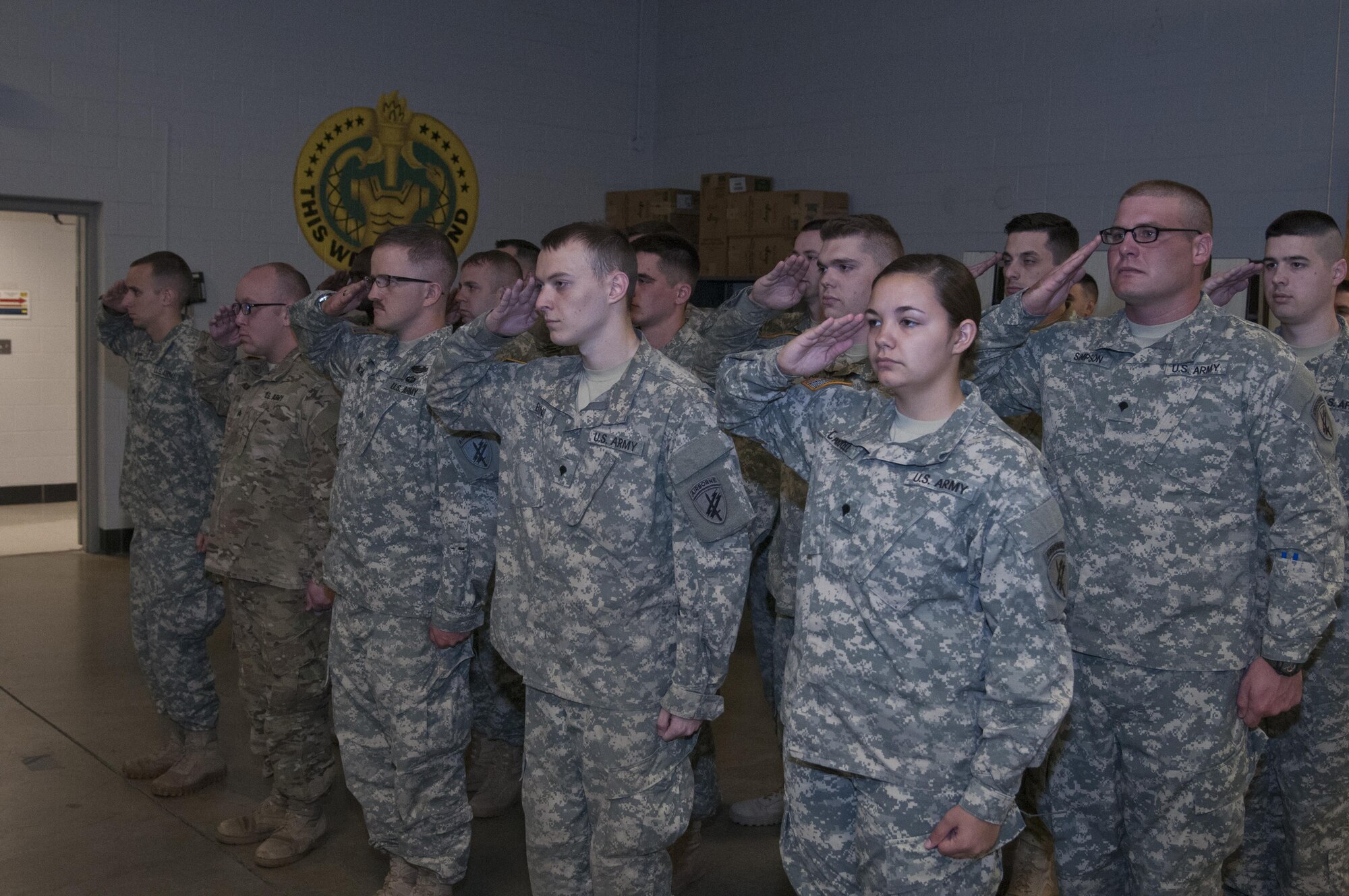 Members of the 316th Psychological Operations Company salute the flag during the playing of national anthem at their deployment ceremony on May 7, 2016 at Grissom Air Reserve Base, Ind. The event gave the soldiers and their families a chance to say goodbye before the deployment began. (U.S. Air Force photo/Senior Airman Dakota Bergl)