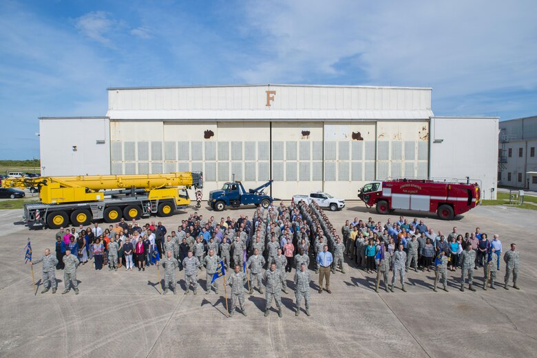 Personnel from the 45th Mission Support pose for a photo during their group’s Commander’s Call April 20, 2016 at Cape Canaveral Air Force Station, Fla. The group's objective was to gather together in a location where the 45th Space Wing's launch operations happen to get up close and personal with the mission and history of the wing in an interactive, informative way. The 45th MSG's five squadrons provide total customer support for the world's busiest spaceport, assuring success of launch, range and expeditionary operations. Also, the 45th MSG Det. 1 is responsible for the day-to-day operations CCAFS. (U.S. Air Force photo by Matthew Jurgens/Released) 