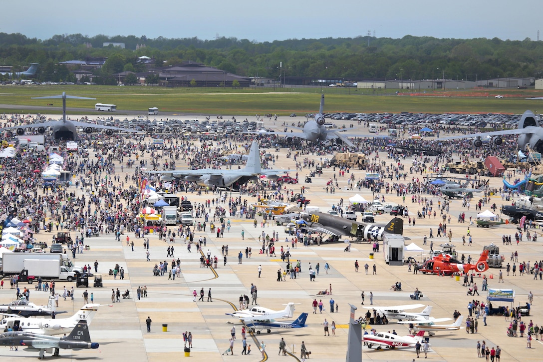 Service members, family members and spectators explore the aircraft and display booths during the Power in the Pines Open House and Air Show at Joint Base McGuire-Dix-Lakehurst, N.J., May 14, 2016. Air National Guard photo by Tech. Sgt. Matt Hecht
