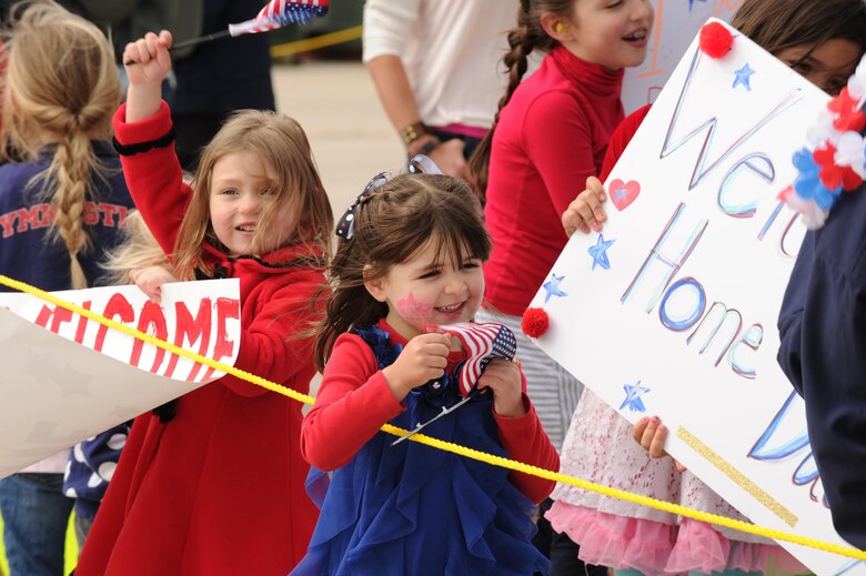 Children anxiously await the return home of their deployed parents to the flightline at Peterson Air Force Base, Colo. May 18, 2016. Approximately 150 Air Force Reservists and four C-130 cargo aircraft from the 302nd Airlift Wing are returned home after a four-month deployment to Al Udeid Air Base, Qatar, in support of Operations Freedom’s Sentinel and Inherent Resolve. While deployed, the Airmen provided critical C-130 airlift support to include airlift, airdrop and aeromedical evacuation to U.S. Central Command operations throughout Southwest Asia. The deployed members of the 302nd Maintenance Group provided aircraft maintenance support ensuring fully mission capable C-130s in Southwest Asia.  (U.S. Air Force photo/Staff Sgt. Amber Sorsek)