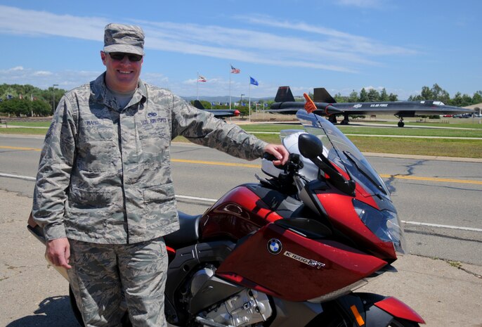 Tech. Sgt. Nicholas Ward, 9th Aircraft Maintenance Squadron assistant 1st Sgt., poses next to his motorcycle May 16, 2016, at Beale Air Force Base, California. (U.S. Air Force photo by Senior Airman Michael J. Hunsaker)