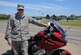 Tech. Sgt. Nicholas Ward, 9th Aircraft Maintenance Squadron assistant 1st Sgt., poses next to his motorcycle May 16, 2016, at Beale Air Force Base, California. (U.S. Air Force photo by Senior Airman Michael J. Hunsaker)