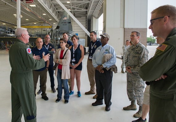 Maj. Shane Devlin, 53rd Weather Reconnaissance Squadron pilot, briefs employers from across the nation about the Hurricane Hunter mission and WC-130J Super Hercules aircraft used to collect weather data sent to the National Hurricane Center in Miami for use in their forecasts.The 403rd Wing hosted 15 employers of Air Force reservists from across the nation as part of the Air Force Reserve Command Employer Appreciation Day May 20, 2016. (U.S. Air Force photo/Marie Floyd)