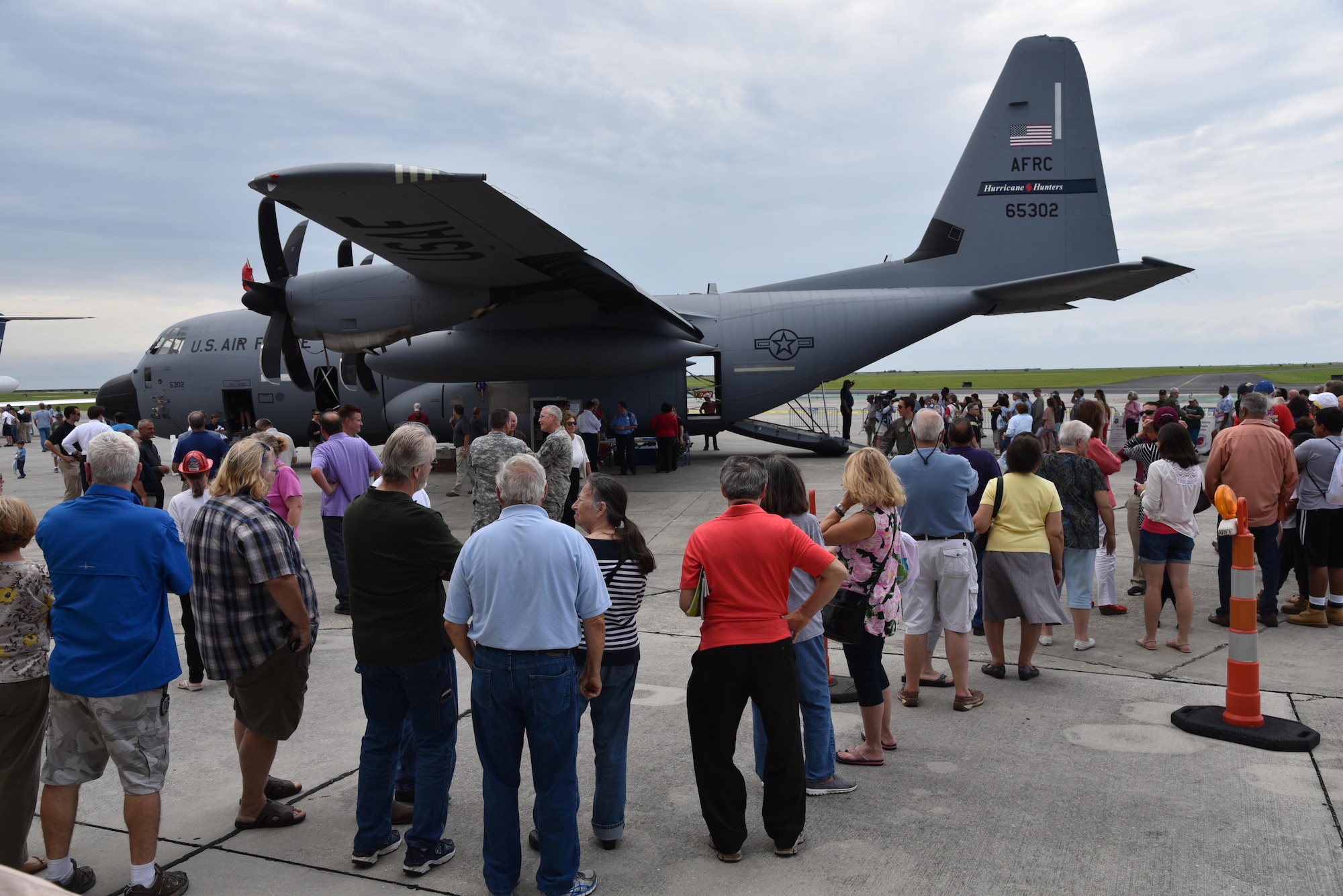 The New Orleans public lines up at the Lakefront Airport May 18, 2016, to tour the WC-130J Super Hercules Aircraft used by the 53rd Weather Reconnaissance Squadron to collect weather data for the National Hurricane Center used to improve their forecasts. An Air Force Reserve Hurricane Hunter aircrew and a team of National Oceanic and Atmospheric Administration hurricane experts visited five Gulf Coast cities as part of the Hurricane Awareness Tour May 16-20, 2016. The tour is a joint effort between NOAA's National Weather Service and National Hurricane Center and the 403rd Wing's 53rd Weather Reconnaissance Squadron to promote awareness about the destructive forces of hurricanes and how people can prepare. (U.S. Air Force photo/Maj. Marnee A.C. Losurdo)