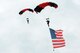 Members of the U.S. Army Special Operations Command Parachute Demonstration Team fly in the American flag, officially beginning the second day of the 2016 Shaw Air Expo and open house, “Thunder Over the Midlands,” at Shaw Air Force Base, S.C., May 22. The Black Daggers perform live aerial demonstrations in support of U.S. Army special operations community relations and recruiting. 
