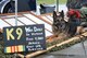 Luke, a retired military working dog, sits at the United States War Dogs Association display at the 2016 Shaw Air Expo and open house, “Thunder Over the Midlands,” at Shaw Air Force Base, S.C., May 21. The U.S. War Dogs Association consists of current and former U.S. MWD handlers committed to promoting the history of military service dogs, establishing permanent war dog memorials and educating the public about the service of MWDs. (U.S. Air Force photo by Senior Airman Zade Vadnais)