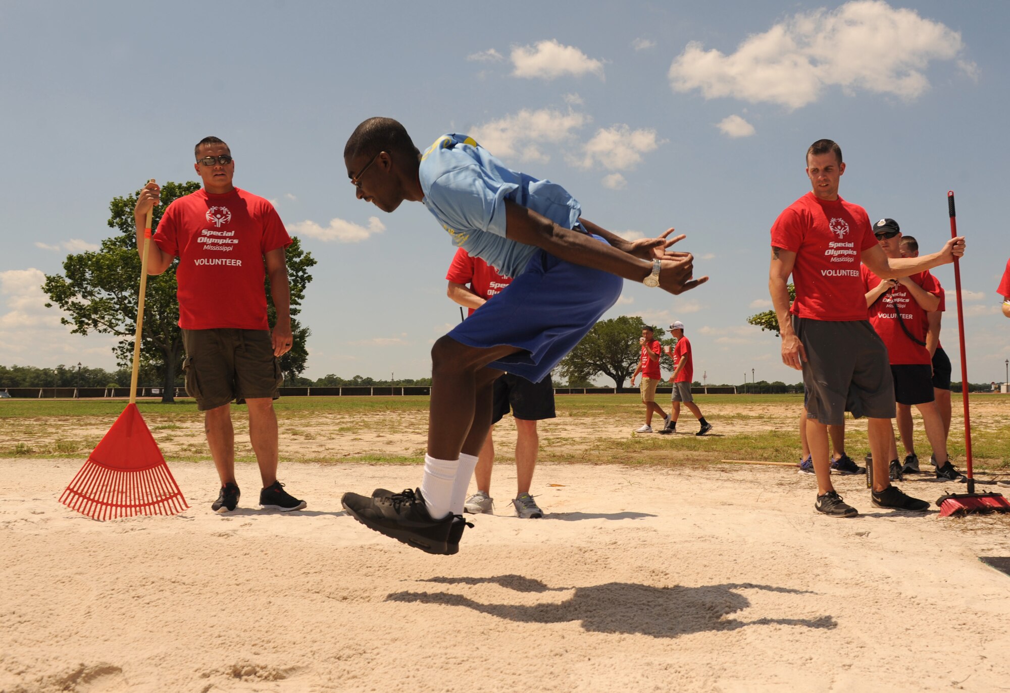 Mike Brown, Special Olympics athlete, participates in the standing long jump competition during the Special Olympics Mississippi Summer Games at the triangle track May 21, 2016, Keesler Air Force Base, Miss. More than 700 athletes and 3,000 volunteers worked together to hold competitions throughout the day. This is the 30th year Keesler has hosted the state Special Olympics.  (U.S. Air Force photo by Kemberly Groue)