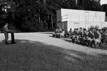 Maj. Brent Gallant (left), 4th Security Forces Squadron commander, speaks during the opening ceremony for Police Week, May 16, 2016, at Seymour Johnson Air Force Base, North Carolina. In 1962, President John F. Kennedy designated May 15 as Peace Officers Memorial Day and the week in which that date falls as Police Week. (U.S. Air Force photo by Airman Shawna L. Keyes/Released)