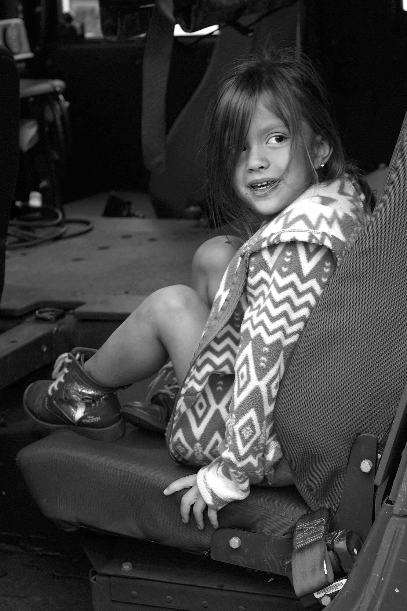 The child of Staff Sgt. Meaghan Farris, 4th Security Forces Squadron combat arms instructor, sits inside a Humvee, May 18, 2016, at Seymour Johnson Air Force Base, North Carolina. During Police Week Airmen from the 4th SFS and 4th Civil Engineer Squadron fire department staged vehicles in the Exchange parking lot for members of Team Seymour to explore. (U.S. Air Force photo by Airman Shawna L. Keyes/Released)   