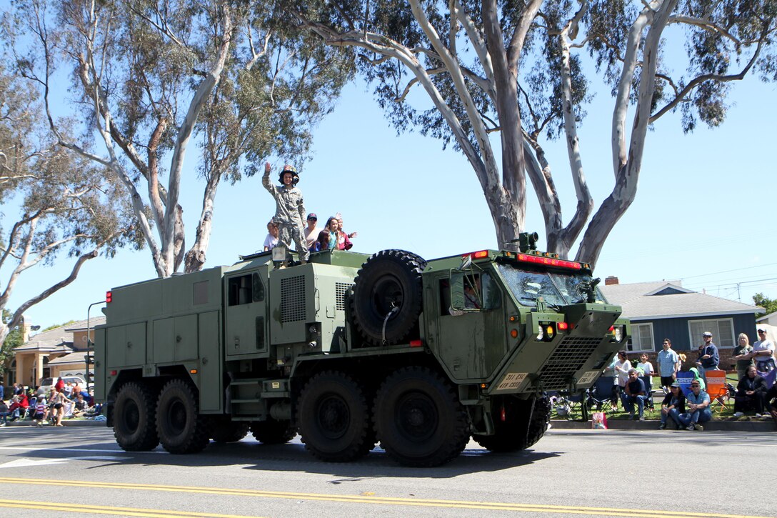 A 1142 Tactical Fire Fighting Truck from the 311th Expeditionary Sustainment Command from Los Angeles, Calif., drives down Torrance Boulevard Torrance, Calif., May 21, 2016, during the Torrance Armed Forces Day Parade. The parade is longest running of its kind; 2016 marking its 57th year. The 1142 Tactical Fire Fighting Truck is ready to deploy in almost any terrain to combat five types of fires/hazards; wildland, structural (limited to two stories or less), petroleum, oils, lubricants, hazardous materials, tactical vehicle fires, and aircraft crashes. (U.S. Army photo by Thomas X. Crough, 201st Press Camp Headquarters/Released).