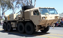 A Heavy Expanded Mobility Tactical Truck wrecker from the 311th Expeditionary Sustainment Command from Los Angeles, Calif., drives down Torrance Boulevard in Torrance, Calif., May 21, 2016, during the Torrance Armed Forces Day Parade. The parade is longest running of its kind; 2016 marking its 57th year. The wrecker is equipped with a recovery winch vehicle retrieval system.
