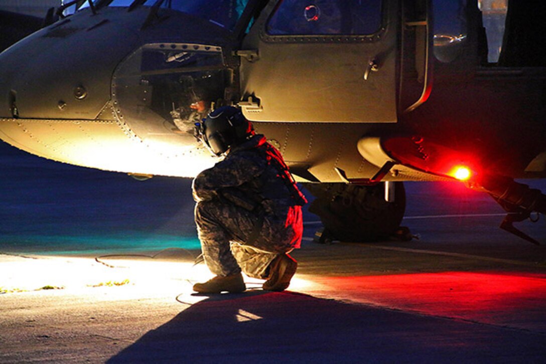 Defense Logistics Agency Aviation's Customer Operations Directorate in Richmond, Virginia is part of a team keeping the UH-60 platforms mission ready. The LED  (light-emitting diode) lights on the M model aircraft were replaced with previously used incandescent lights because of a halo and glare problem when using night vision equipment. Shown here the Puerto Rico National Guard Aviation prepares to conduct night flight training aboard UH-60 Black Hawk helicopters, with the assistance of helmet-mounted AN/AVS-6 vision goggles, at the Aviation Support Facility in Isla Grande, Sept. 2, 2014. 