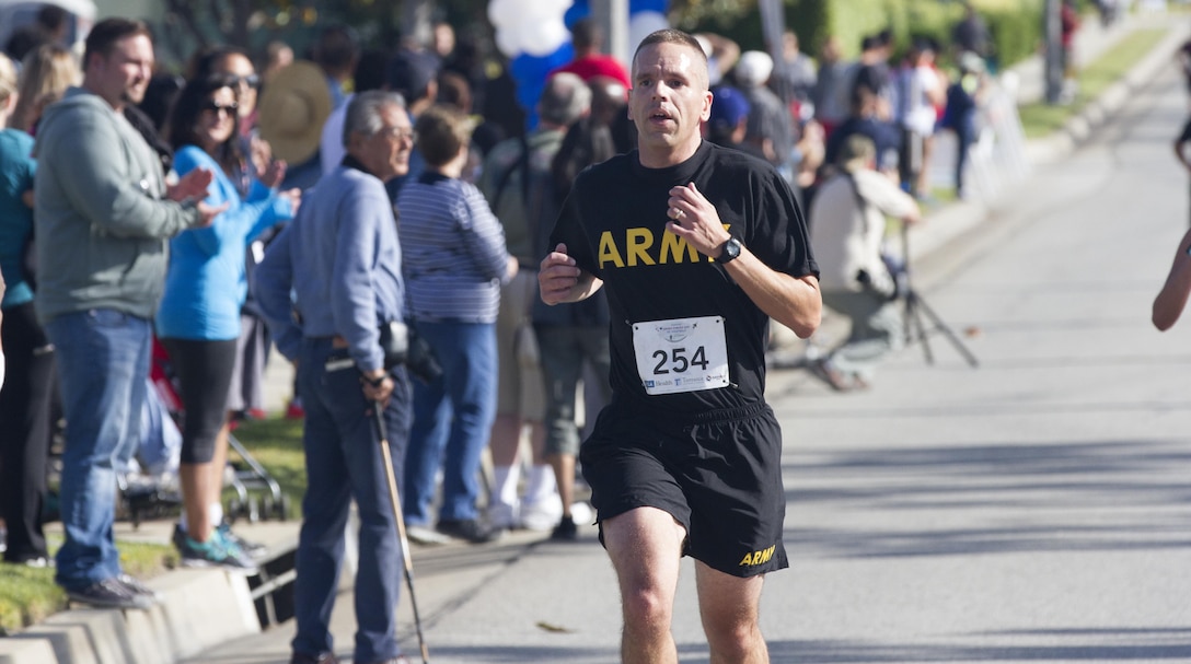 Lt. Col. Timothy Hyde, Deputy Director, Western Region, U.S. Army Public Affairs Film and Television Liason, Los Angeles, Calif., races to the finish line during the Armed Forces Day 5K Run/Walk in Torrance, Calif., May 21, 2016, during the Torrance Armed Forces Day Celebration. This is the first year the 5K is part of the celebration and is planned to reoccur every year. (U.S. Army Photo by Sgt. Thomas X. Crough, 201st Press Camp Headquarters).