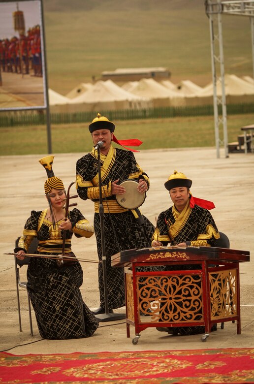 The Mongolian Military Dance and Song Ensemble perform traditional Mongolian music for service members of participating nations for the Khaan Quest 2016 opening ceremony at Five Hills Training Area, Mongolia, May 22, 2016. Khaan Quest is an annual, multinational peacekeeping operations exercise conducted in Mongolia and is the capstone exercise for this year's United Nations Global Peace Operations Initiative program. 