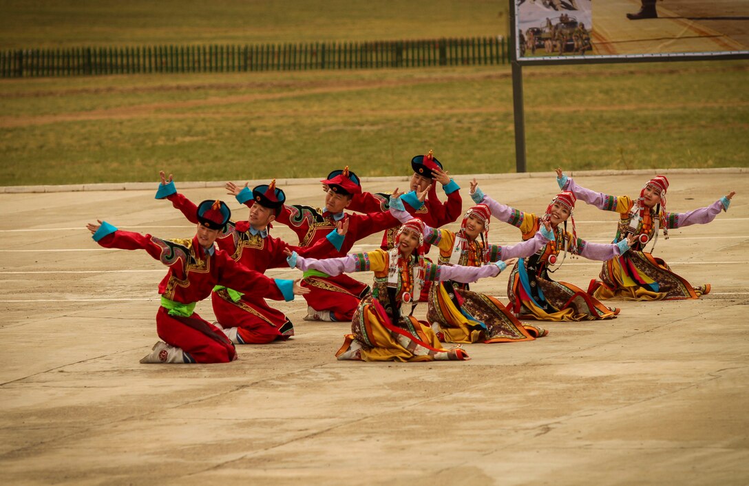 The Mongolian Military Dance and Song Ensemble perform a traditional Mongolian dance for service members of participating nations for the Khaan Quest 2016 opening ceremony at Five Hills Training Area, Mongolia, May 22, 2016. Khaan Quest is an annual, multinational peacekeeping operations exercise conducted in Mongolia and is the capstone exercise for this year's United Nations Global Peace Operations Initiative program.