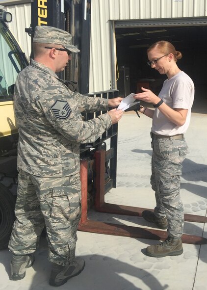 Master Sgt. Logan Goldschmidt, 944th Logistics Readiness Squadron traffic management craftsman, reviews the vehicle inspection procedures with Senior Airman Michelle Busse, 944th Logistics Readiness Squadron traffic management apprentice, during Material Handling Equipment training April 9 at Luke Air Force Base, Ariz. (Courtesy photo)