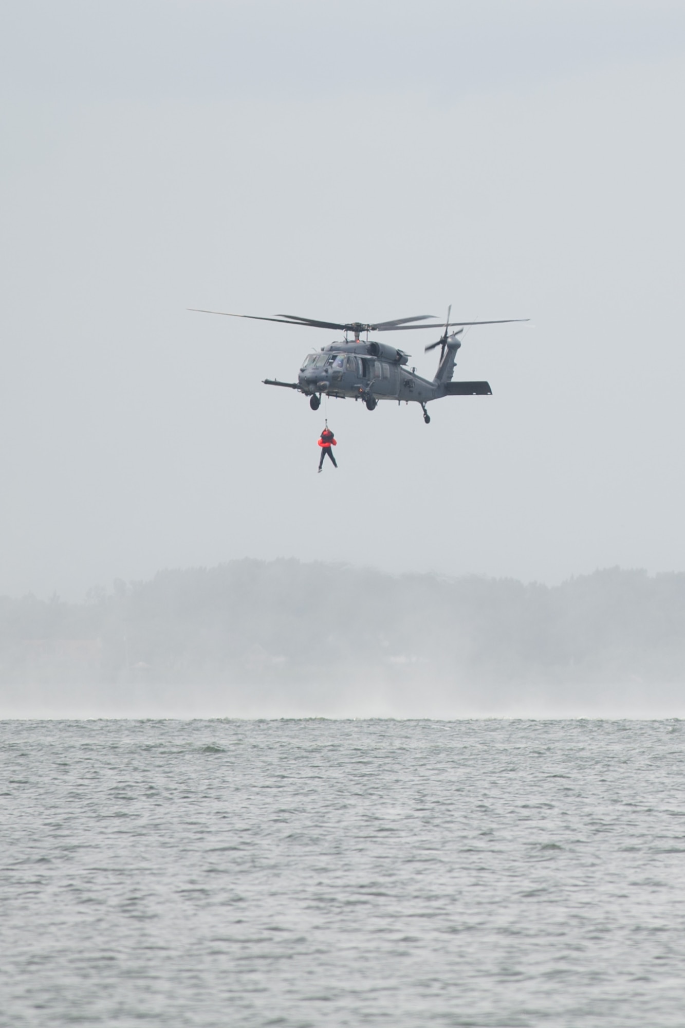 The 301st Rescue Squadron, of the 920th Rescue Wing, use their HH-60 Pave Hawk to hoist aircrew from the 445th Airlift Wing, Wright-Patterson AFB, Ohio, during a water survival training course held at Patrick AFB, Fla., May 17, 2016. Trainees simulated needing rescue from the Banana River. The 920th RQW is an Air Force Reserve Command combat-search-and-rescue unit. (U.S. Air Force photos/Benjamin Thacker/Released)
