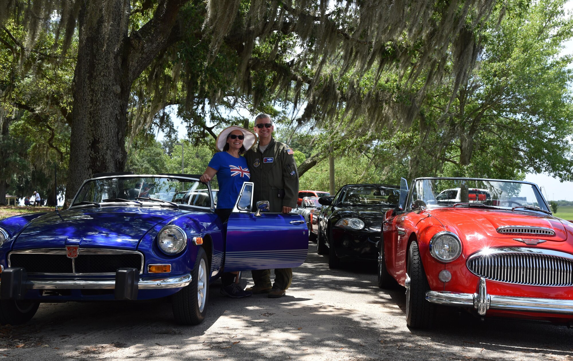 Lt. Col. Jeff Ragusa, 53rd Weather Reconnaissance Squadron pilot, and his wife Susan, are members of the British Car Club of New Orleans. They own a 1974 MGB Roadster that Ragusa bought and drove  as a college student years ago. The car club commemorated the Post World War II use of U.S. Air Force runways for auto racing by driving down the Keesler Air Force Base, Mississippi, runway May 21, 2016. In the Post-WWII era of early U.S. auto racing, there were several tragedies due to people racing on roadways. This mandated the move from road racing to tracks. However, before the tracks were ready, Gen. Curtis LeMay, a sports car enthusiast, allowed the use of U.S. Air Force runways at Strategic Air Command bases to the Sports Car Club of America for racing. The first two SCCA champions in 1951 and 1952 drove British sports cars. (U.S. Air Force/Maj. Marnee A.C. Losurdo)