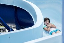 Rebekah White, daughter of U.S. Air Force Tech. Sgt. Aprille White, 23d Aerospace Medicine Squadron, rockets down a water slide during the “School’s Out Splash Party,” May 20, 2016, at Moody Air Force Base, Ga. The Outdoor Pool has a water slide that allows thrill seekers to plunge into water at an accelerated speed. (U.S. Air Force Photo by Airman 1st Class Janiqua P. Robinson/Released)