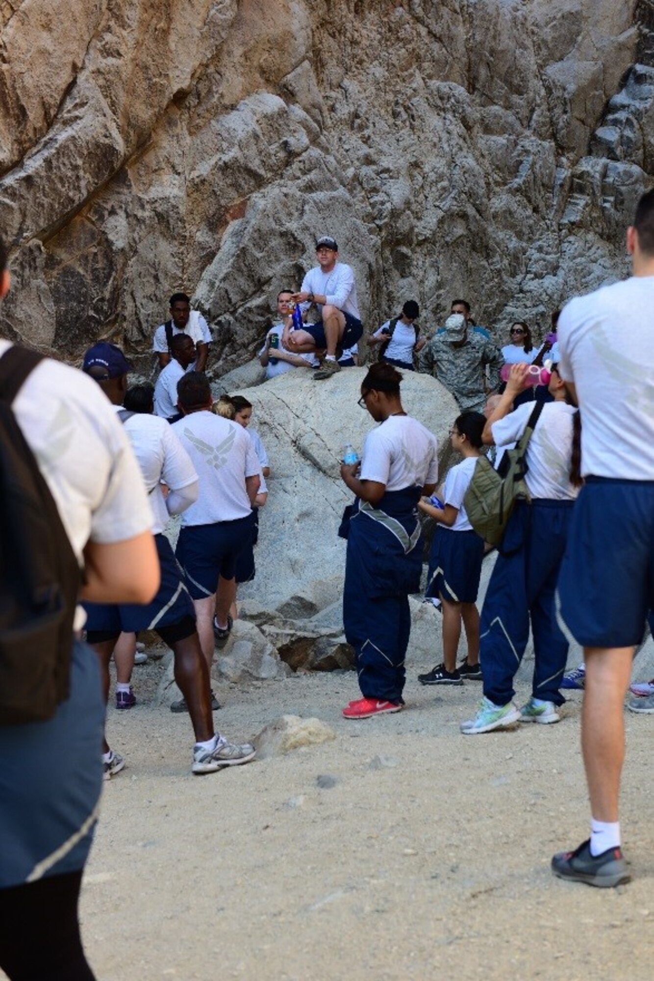 Chaplain (1st Lt.) Derek Vandermolen, 56th Fighter Squadron, speaks to members of the 944th Force Support Squadron about spiritual fitness during a hike at White Tank Mountain Regional Park, Ariz. April 29, 2016. Vandermolen joined the FSS on the hike to share with Airmen the importance of metal, physical, and spiritual health. The group of 48 Airmen also included two medics on stand-by to provide medical support to help ensure everyone’s safety.  (U.S. Air Force photo by Staff Sgt. Lausanne Kinder)