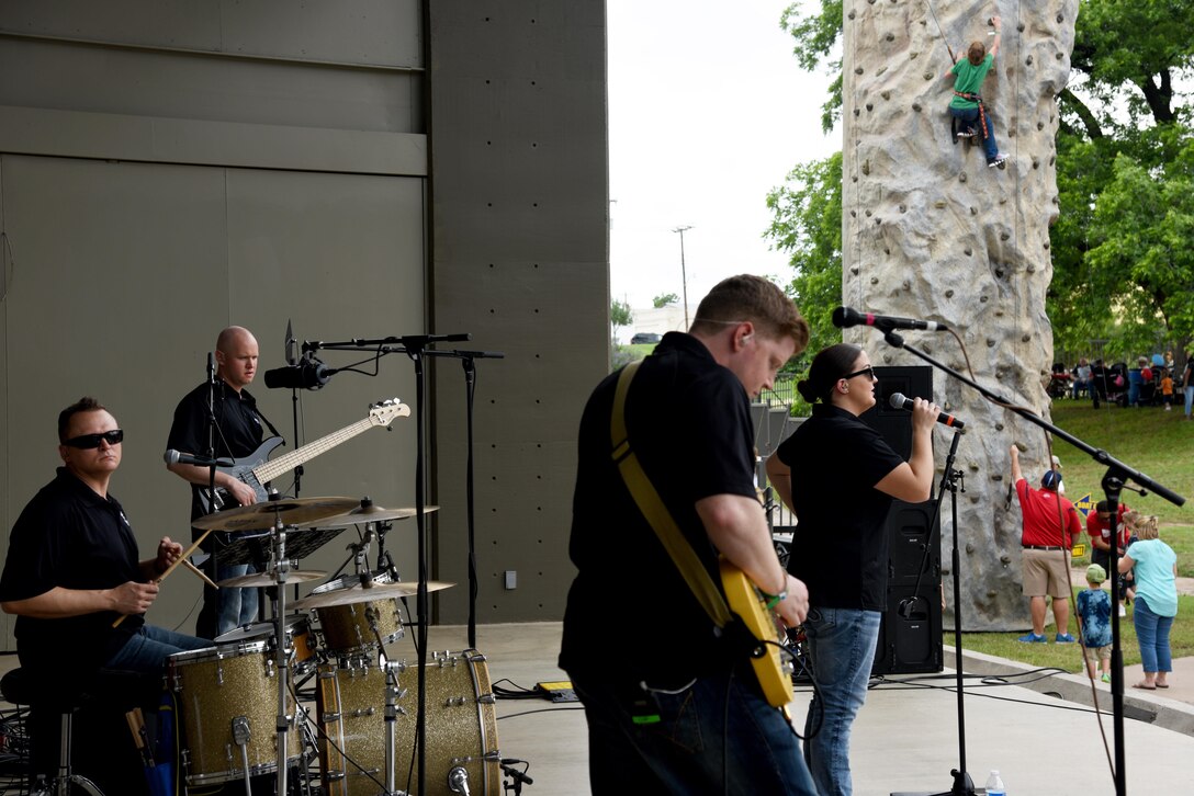 The U.S. Air Force Band of the West, Sky Country, performs during Goodfellow Appreciation Day at the RiverStage in San Angelo, Texas, May 21, 2016. While the band played, event attendees could eat or enjoy various recreational activities. The San Angelo Chamber of Commerce hosts the event every year on Armed Forces Day to celebrate local service members. (U.S. Air Force photo by Senior Airman Joshua Edwards/Released)