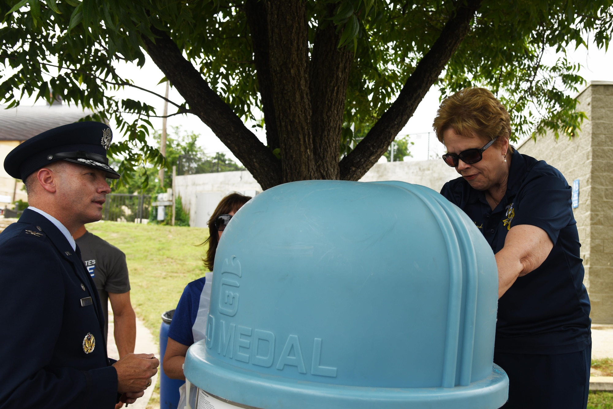 U.S. Air Force Col. Michael L. Downs, 17th Training Wing Commander, speaks with Dr. Carol Ann Bonds, Texas Military Preparedness Commission member, at a cotton candy stand during Goodfellow Appreciation Day at the RiverStage in San Angelo, Texas, May 21, 2016. The San Angelo Chamber of Commerce hosts the event every year on Armed Forces Day to celebrate local service members. (U.S. Air Force photo by Senior Airman Joshua Edwards/Released)