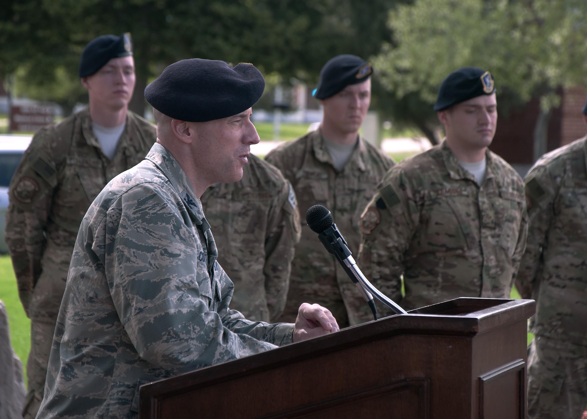 Col. Christopher Corley, 90th Security Forces Group commander, speaks to defenders about the history of National Police Week during a final guard mount and retreat ceremony on F.E. Warren Air Force Base, Wyo., May 16, 2016. During his speech, Corley explained the importance of Police Week was to remember the fallen and pay tribute to the sacrifice of those serving. (U.S. Air Force photo by Senior Airman Brandon Valle)