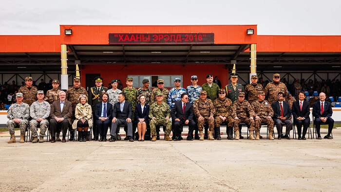 Distinguished visitors and multinational participants pose for a photo after the opening ceremony for Khaan Quest 2016, at the Five Hills Training Area, Mongolia, May 22, 2016. Khaan Quest is an annual, multinational peacekeeping operations exercise conducted in Mongolia and is the capstone exercise for this year's United Nations Global Peace Operations Initiative program. 