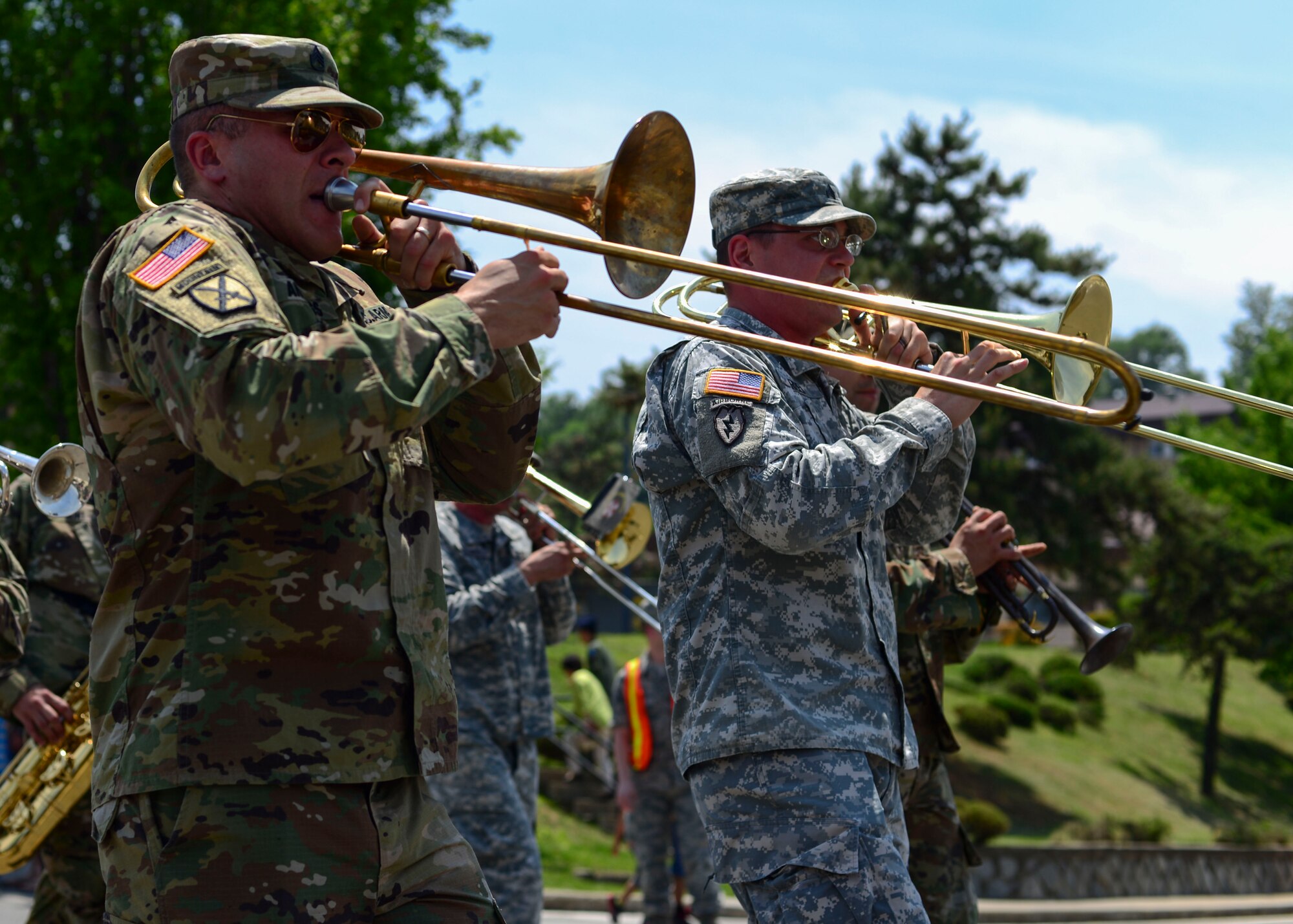 Soldiers assigned to the 8th Army Band perform during the Armed Forces Day Parade at Osan Air Base, Republic of Korea, May 21, 2016. The band was one of the many participants in the parade, which was hosted by the local Veterans of Foreign Wars, Post 10216. (U.S. Air Force photo by Senior Airman Victor J. Caputo/Released)