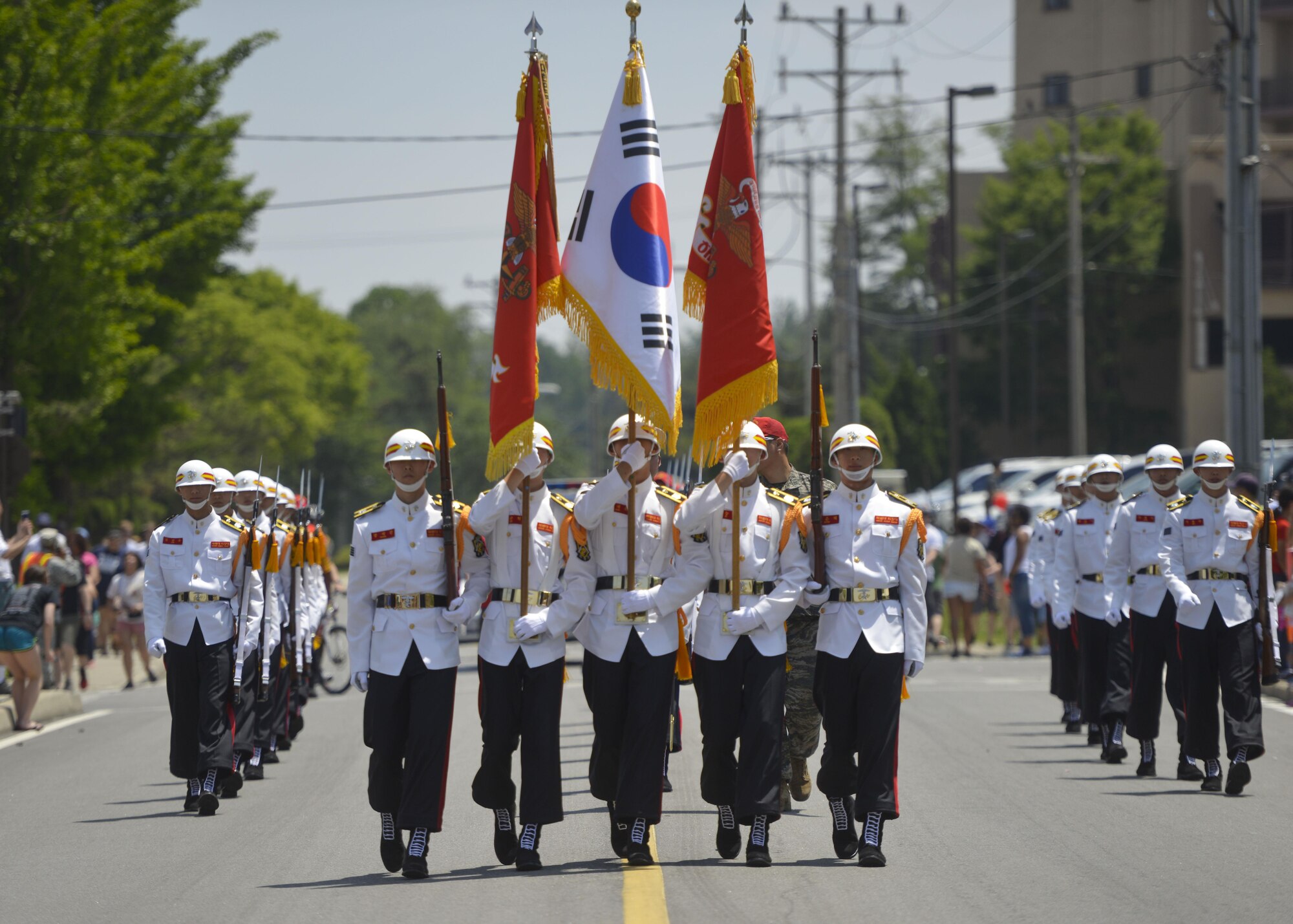 Members of the Republic of Korea marine corps drill team march in the Armed Forces Day Parade at Osan Air Base, Republic of Korea, May 21, 2016. The drill team held a demonstration at the end of the parade and performed alongside their accompanying band. (U.S. Air Force photo by Senior Airman Victor J. Caputo/Released)