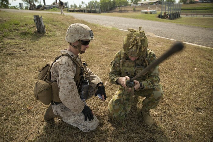 U.S. Marine Sgt. Devon L. Ward and Australian Army Pvt. Jacob Handley, combat engineers, perform a radio check at Hidden Valley Motor Sports Complex, Northern Territory, Australia, on May 19, 2016. U.S. Marine and Australian Army combat engineers conducted clearing training to find improvised explosive device and caches. Marine Rotational Force - Darwin is a six-month deployment of Marines into Darwin, Australia, where they will conduct exercises and train with the Australian Defence Forces, strengthening the U.S.-Australia alliance. Ward, from Grand Rapids, Michigan, is with 1st Combat Engineer Battalion, MRF-D. Handley, is with 1st Combat Engineer Regiment, 1st Brigade.