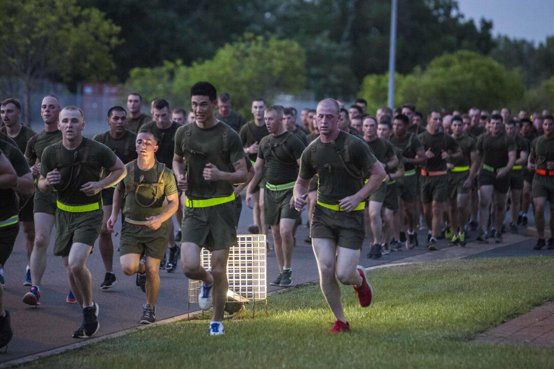 U.S. Marines with 1st Battalion, 1st Marine Regiment, run in formation on Robertson Barracks, Darwin, Australia, April 29, 2016. Running together helps Marines acclimatize to the hot and humid Australian environment during Marine Rotational Force - Darwin (MRF-D). MRF-D is a six-month deployment of Marines into Darwin, Australia, where they will conduct exercises and train with the Australian Defence Forces, strengthening the U.S.-Australia alliance.
