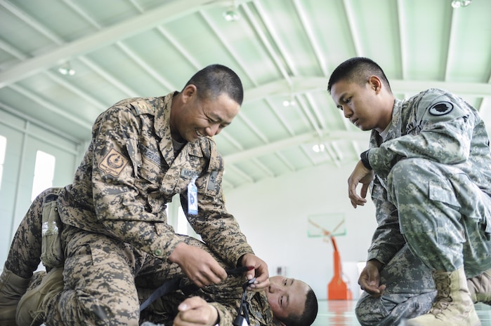 160523-N-WI365-060 ULAANBAATAR, Mongolia (May 23, 2016) - Members of the Mongolian Armed Forces are trained on how to properly apply a tourniquet during a casualty control familiarization class as part of Khaan Quest 2016. Khaan Quest 2016 is an annual, multinational peacekeeping operations exercise hosted by the Mongolian Armed Forces, co-sponsored by U.S. Pacific Command, and supported by U.S. Army Pacific and U.S. Marine Corps Forces, Pacific. Khaan Quest, in its 14th iteration, is the capstone exercise for this year’s Global Peace Operations Initiative program. The exercise focuses on training activities to enhance international interoperability, develop peacekeeping capabilities, build to mil-to-mil relationships, and enhance military readiness.